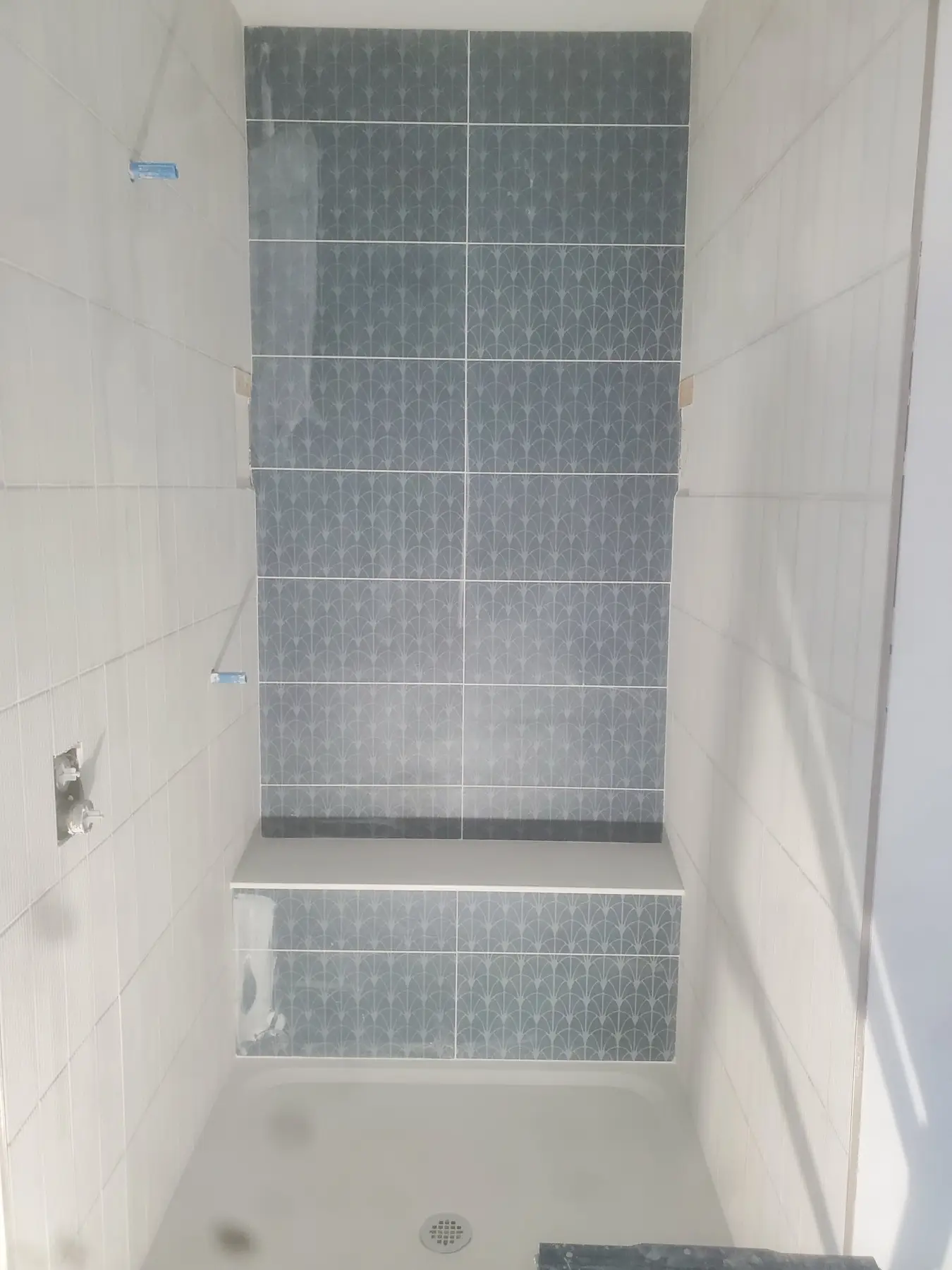 Blue patterned tile bathroom remodel